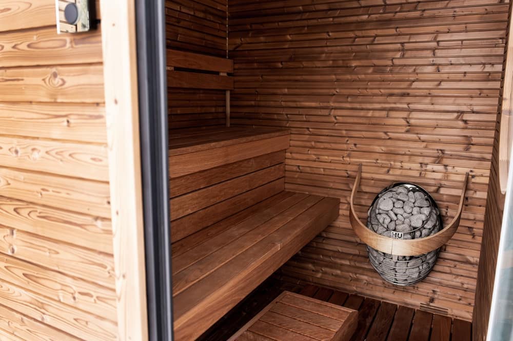 The interior of a multi-modality recovery studio with a sauna and plunge